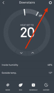 Nest app screen with red arrow pointing to the settings gear icon